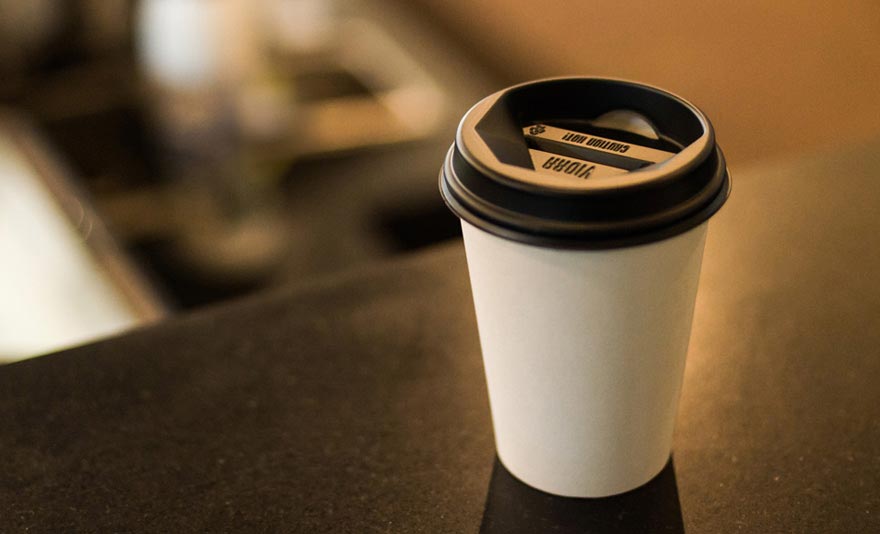 Drinking coffee from plastic cups