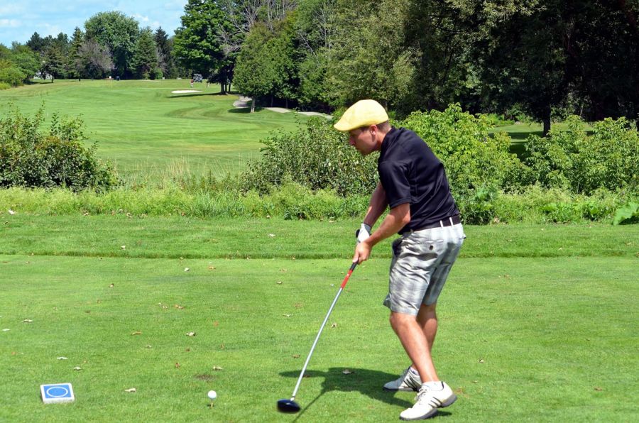 Male golfers often tuck their shirt in